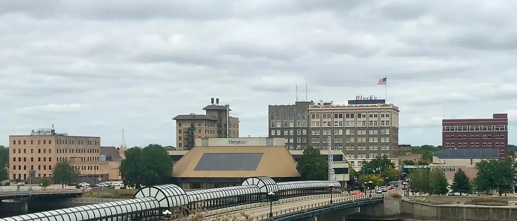 Waterloo skyline above the Cedar River and its riverfront walkway.