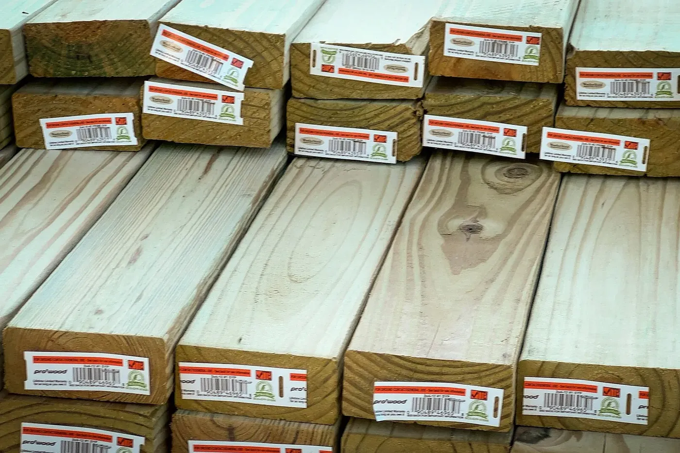 Neatly stacked new lumber, ready for building.